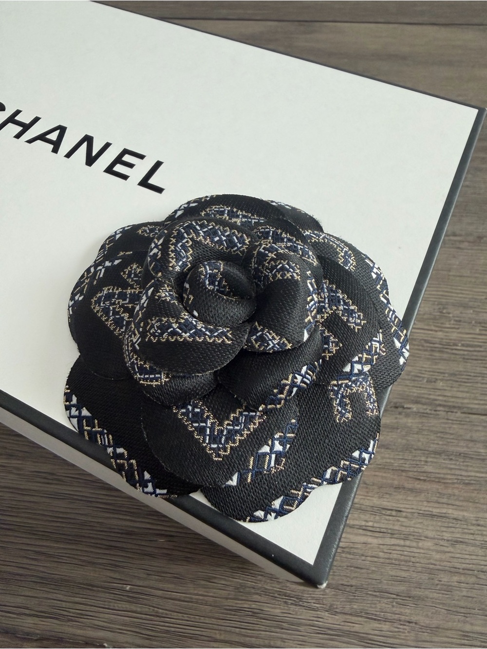 CHANEL Black Fabric Camellia with White and Gold Accents - Picture 2 of 4